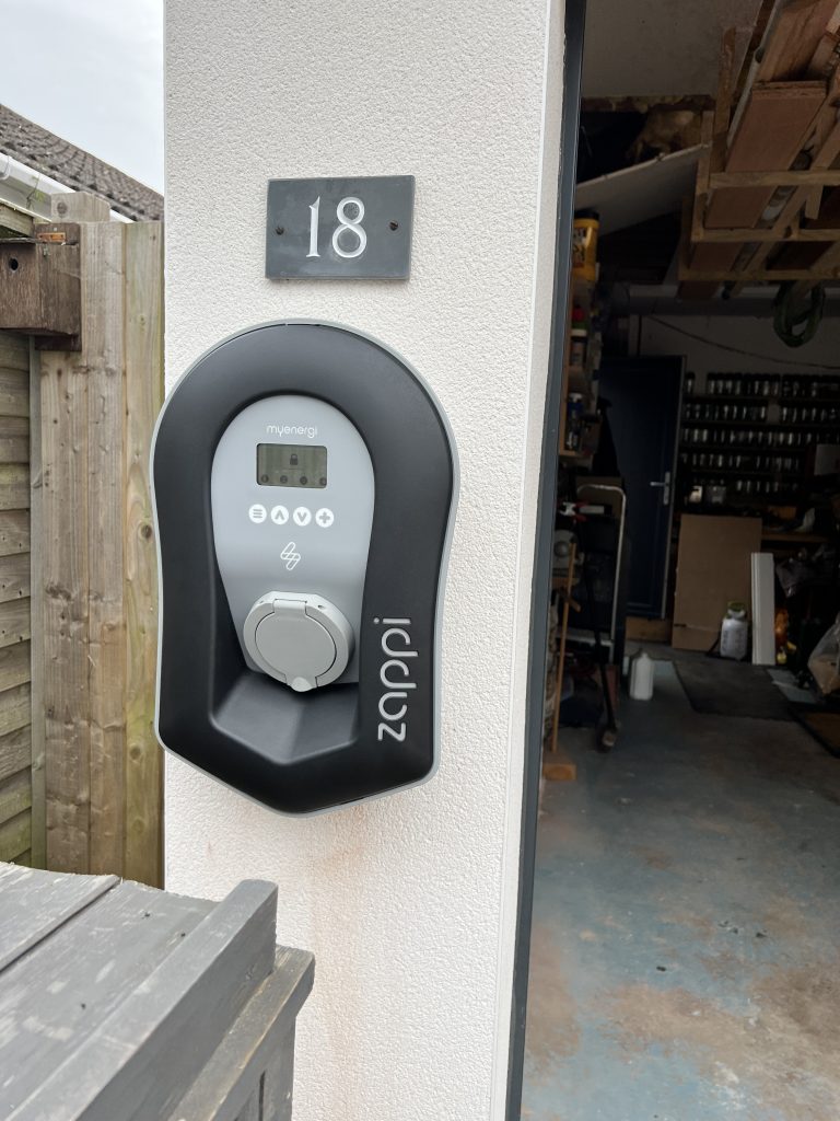 Image of a Zappi EV Charger in Southam on a residential home.