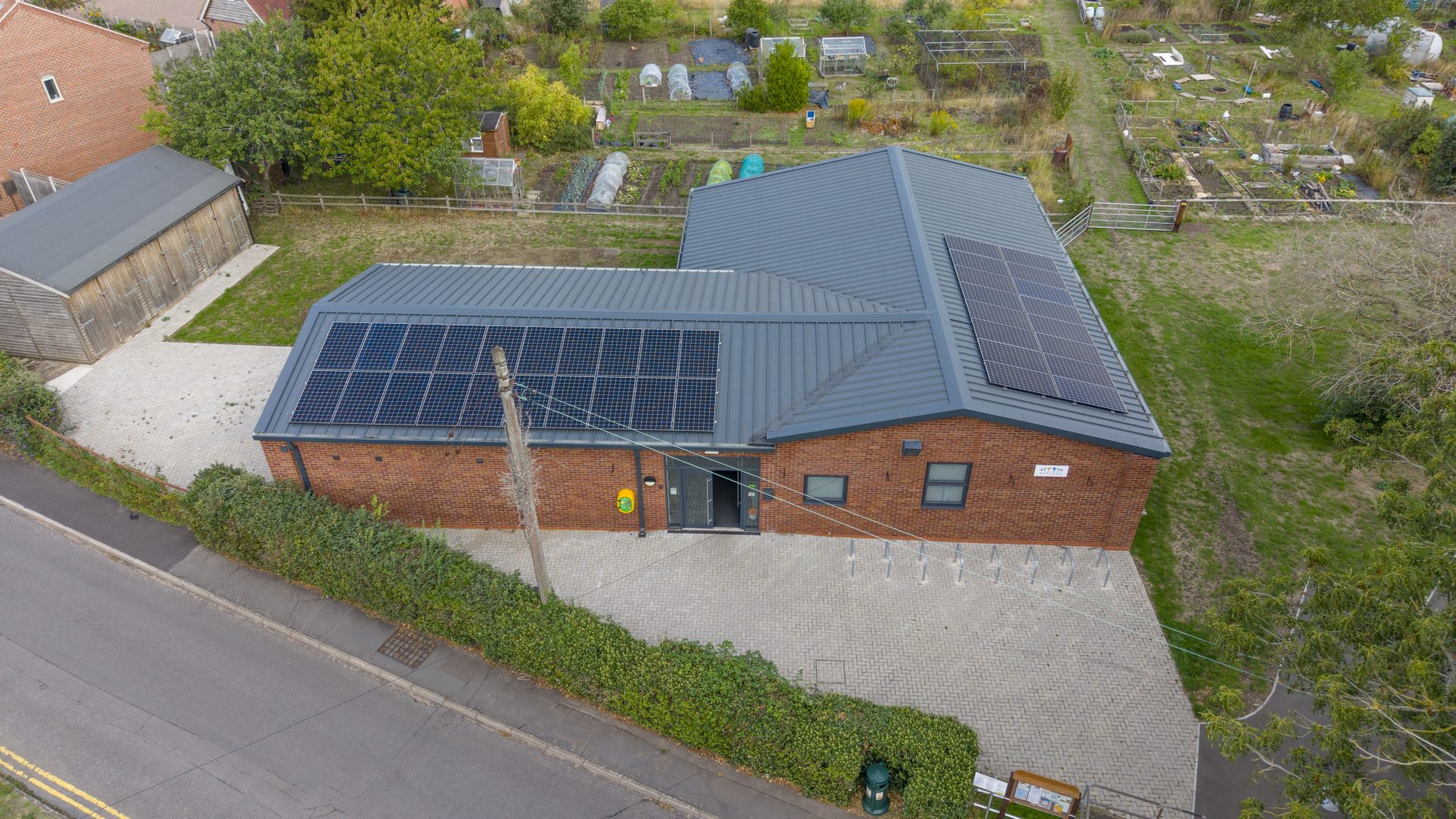 An aerial view of solar panels installed on the roof of Barford Youth & Community Centre by Stratford Energy Solutions.