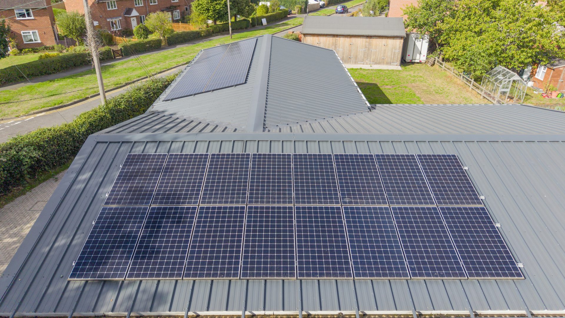 A close-up aerial view of solar panels installed on the roof of Barford Youth & Community Centre by Stratford Energy Solutions.