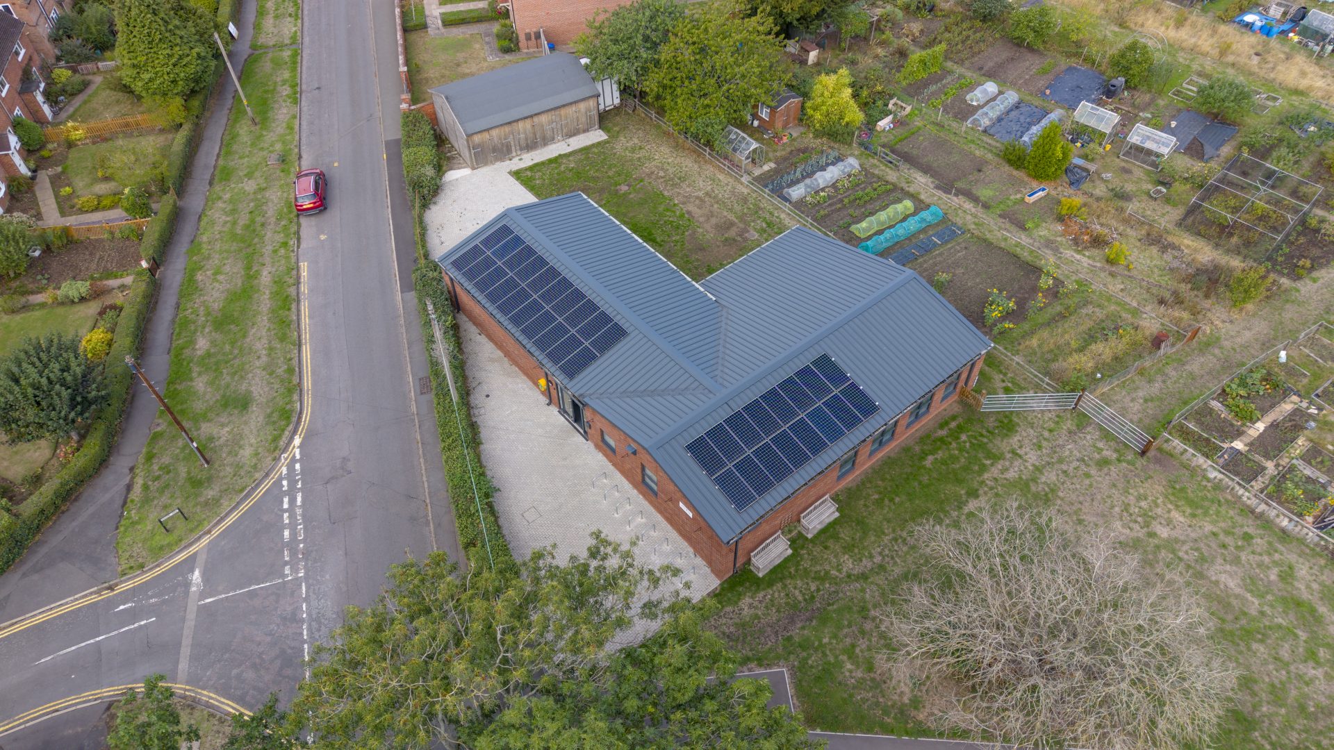 An aerial view of solar panels installed on the roof of Barford Youth & Community Centre by Stratford Energy Solutions.