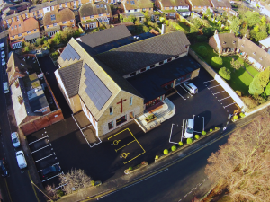 Aerial view of Stratford Methodist Church with solar panels installed on the roof.