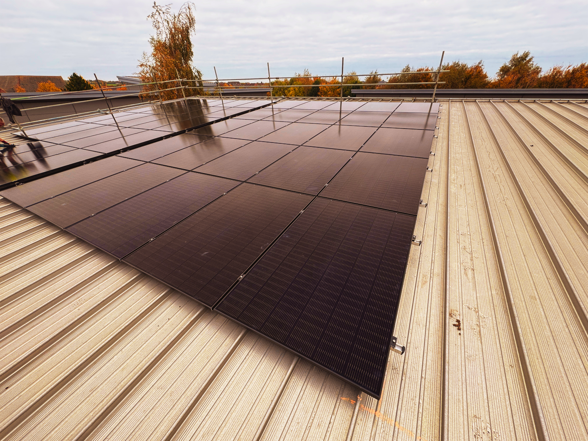 Commercial solar panel system installed on the roof at Apex Recruitment.