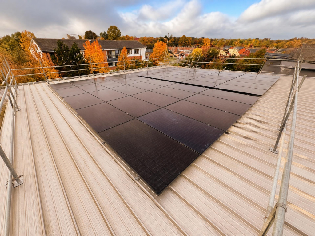 Commercial solar panel system installed on the roof at Apex Recruitment.